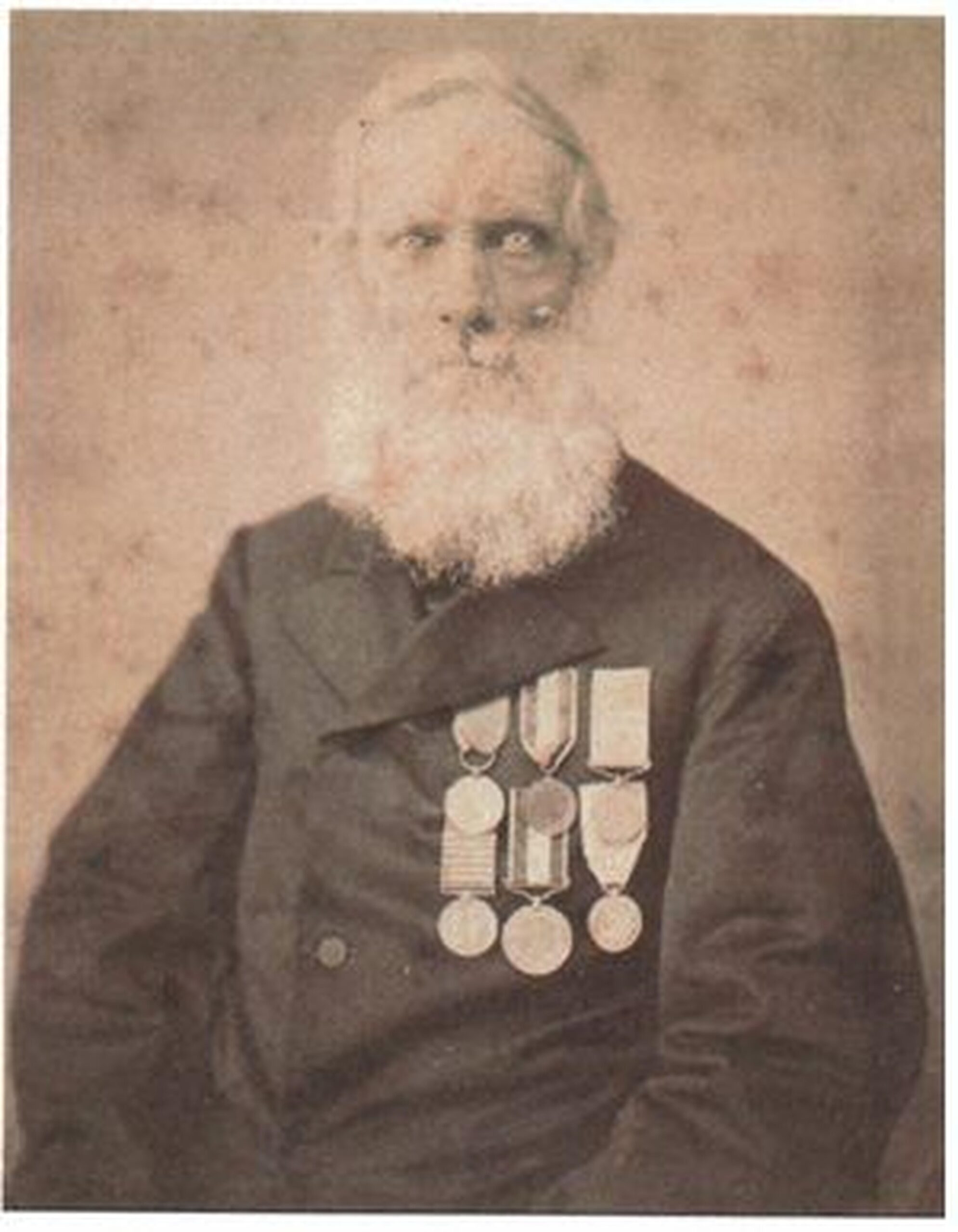 A portrait of a man wearing military medals